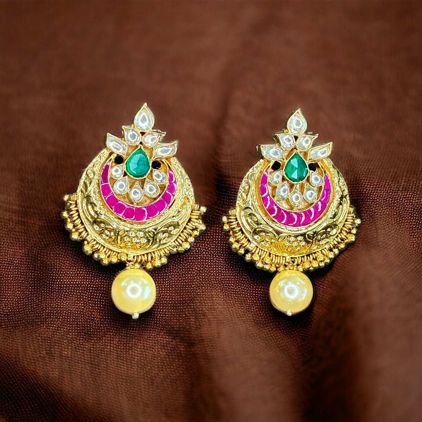 Gold Finished Kundan Earrings with green and pink detailing with pearl drops