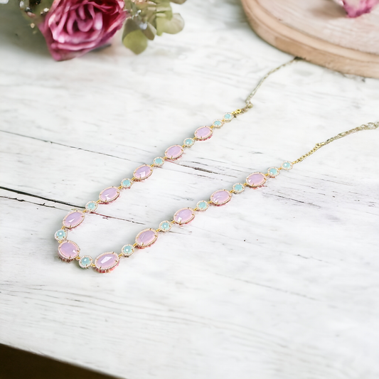 String with pastel pink and blue stones in rose-gold finish